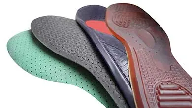 Three fanned-out shoe insoles on a white background: a translucent brown gel, a blue with a red heel pad, and a perforated black version.