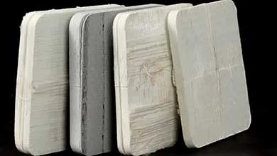 Stacked rectangular composite panels in light and dark tones displayed against a black background.